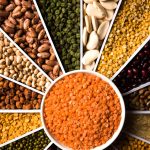 indian-beans-pulses-lentils-rice-wheat-grain-white-sunburst-sun-rays-shape-designer-container-selective-focus-min